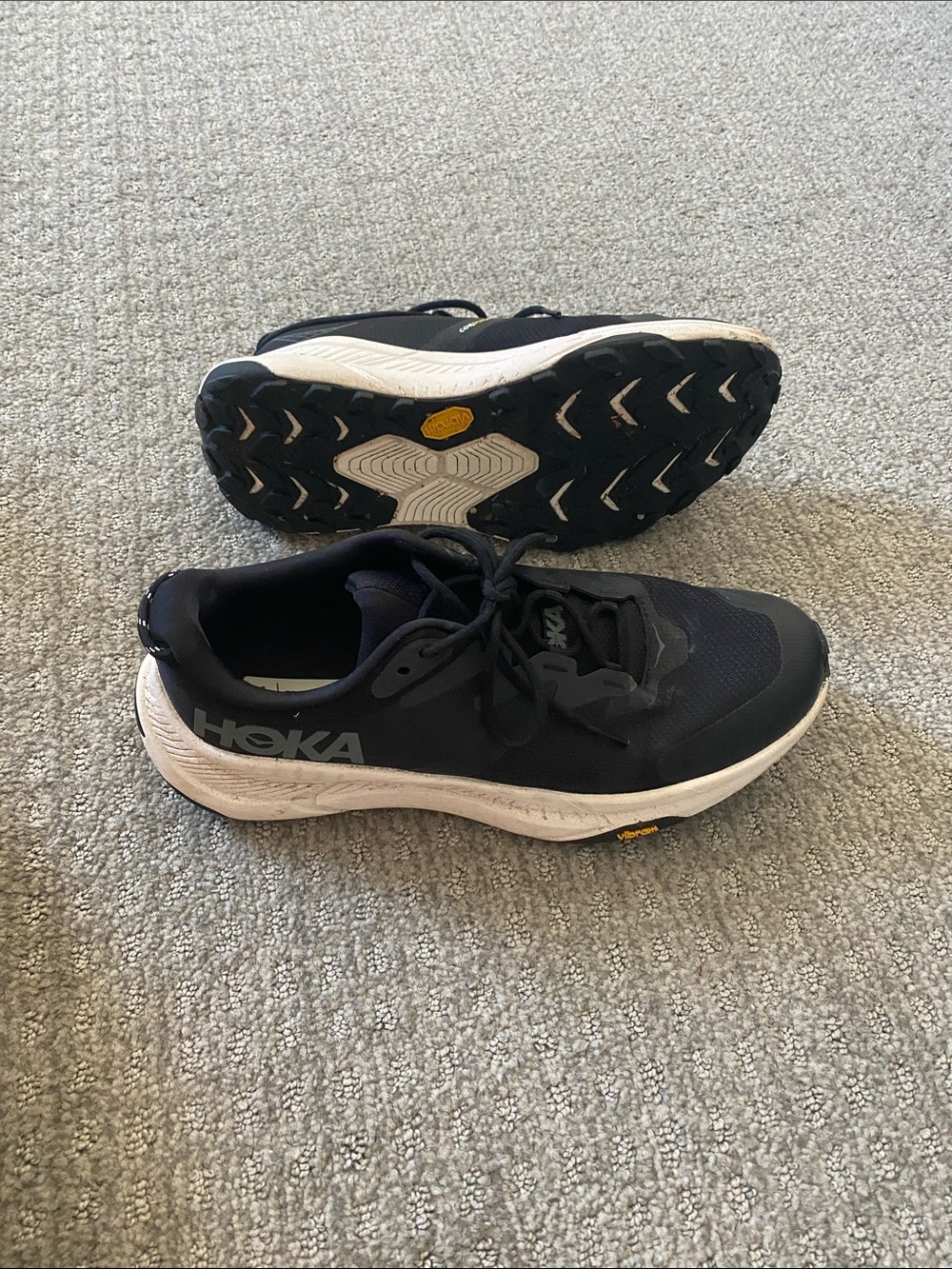 Hoka Black and White Transport running shoes